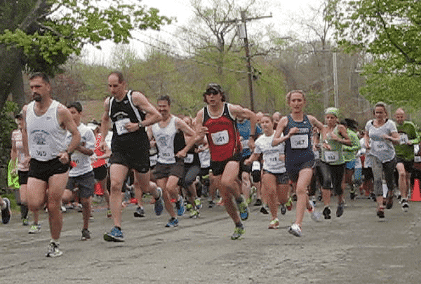 Norm Bouthillier and Katie Moulton, first place finishers, get a quick start at the the Rocky Point 5K on May 10, 2014.