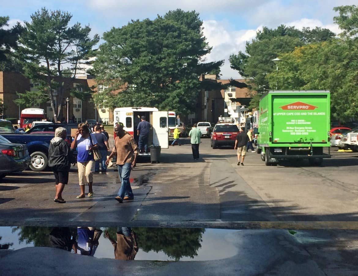 The lot at Four Seasons Apartments was full of emergency services vehicles and tenants collecting their belongings following a fire there Sept. 19.