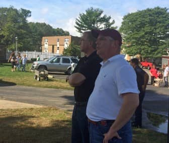 Warwick Fire Chief Edmund Armsrong and Mayor Scott Avedisian assess the damage at Four Seasons Apartments following a fire there Sept. 19.