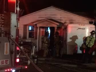 [CREDIT: Rob Borkowski} Warwick Firefighters check the inside of 155 Greeley Ave. after putting out a fire in the home Dec. 28.