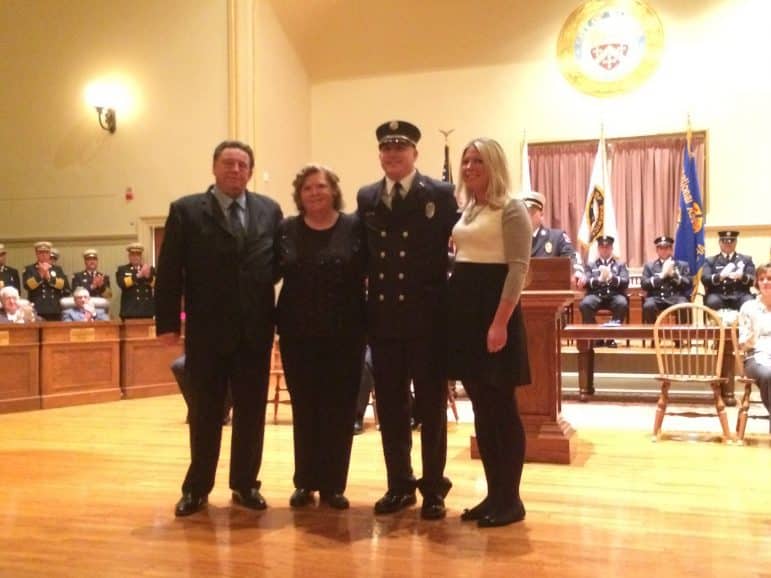 [CREDIT: Rob Borkowski] Michael Kretchman, newly promoted to Rescue Lt., with his wife Jess and his parents.