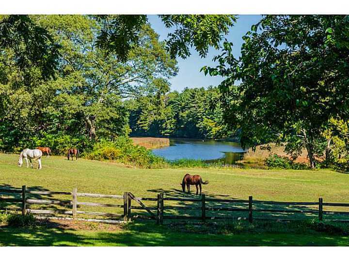 [CREDIT: Statewide MLS] The exterior bakc of 1220 Ives Road, overlooking Green River. 