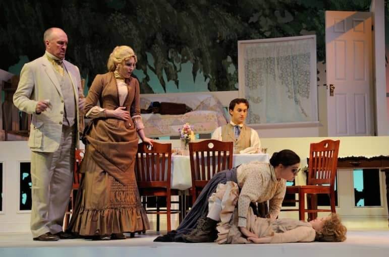 [CREDIT: Mark Turek] From left: Kevin B McGlynn as Captain Keller, Kristin Wetherington as Kate Keller, and Joseph DePietro as James Keller watch as Annie Sullivan, played by Brittany Rolfs, attempts to control her pupil, Helen Keller, played by Laurel McMahon.