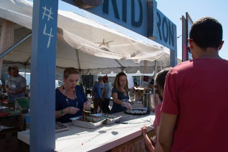 [CREDIT: Mary Carlos] From left, Grid Iron team members Cassie and Kerri Rawcliffe serve hungry patrons at the Great Chowder Cookoff.