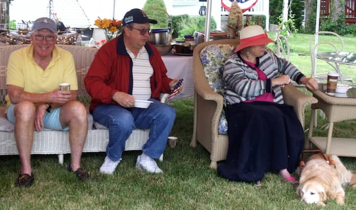 [CREDIT: Beth Hurd] Alfred Nazareth III, left, sits comfortably with members of his family awaiting the start of the annual Gaspee Days parade on Saturday, June 11.