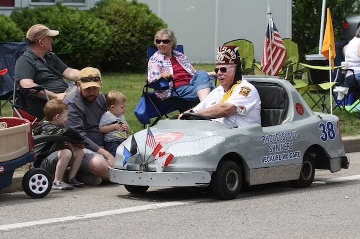 [CREDIT: Beth Hurd] A member of the Rhode Island Shriners - a parade favorite - stops to chat with young parade fans along the route.