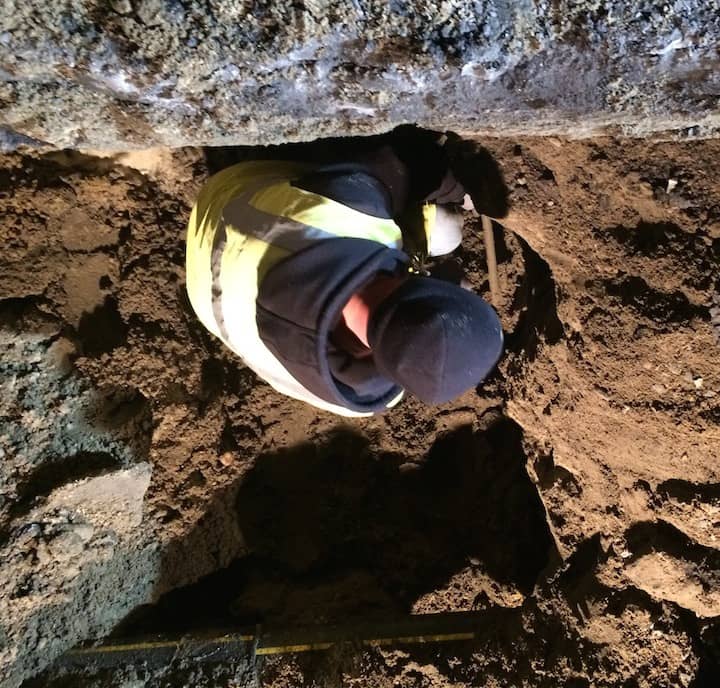 [CREDIT: Rob Borkowski] A Warwick Water Department employee works to fix a water main break at 38 Dryden Boulevard.