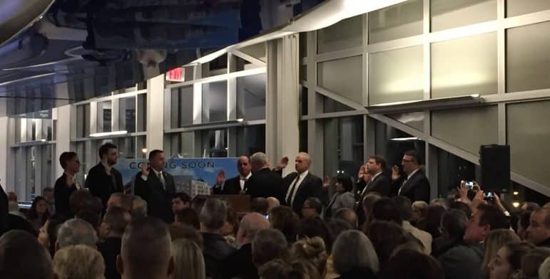 [CREDIT: Lauren Slocum] Mayor Scott Avedisian swears in the Warwick City Council, including new members, from left, Richard Corley, Jeremy Rix, and Tiimothy Howe.