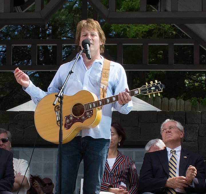 [CREDIT: Mary Carlos] Singer/Songwriter Joe Silva tells the story of '97 Angels' before performing the song at the Station Fire Memorial dedication.