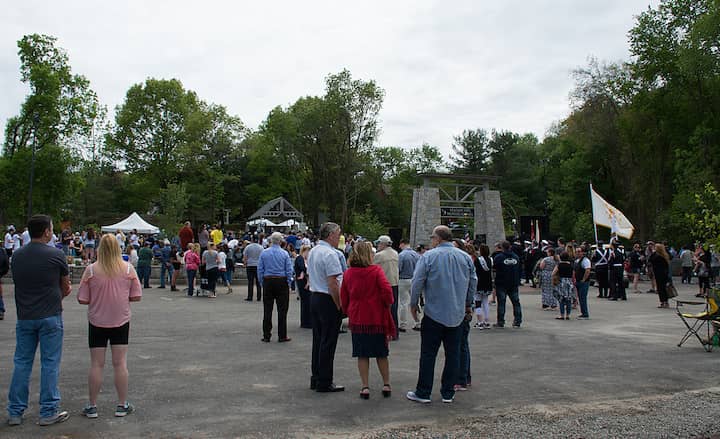 [CREDIT: Mary Carlos] A gathering crowd waits for the Station Memorial dedication Sunday.