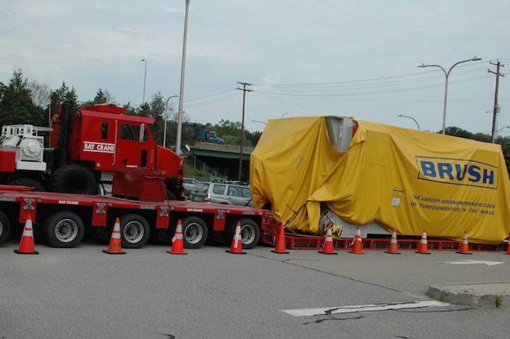 [CREDIT: Rob Borkowski] A 280-ton generator sits at the Rte. 117 park & ride while a safe route over RI bridges is planned.