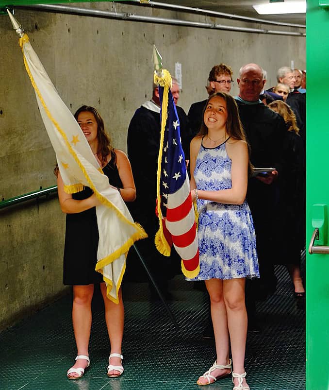 [CREDIT: Lauren Kasz] The Rhode Island and U.S. flags led the Processional at the Pilgrim High School Class of 2017 graduation.