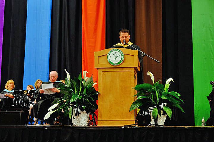 [CREDIT: Lauren Kasz] Assistant Principal Bruce Fairbanks addresses graduates at CCRI during the Pilgrim High School Class of 2017 graduation.