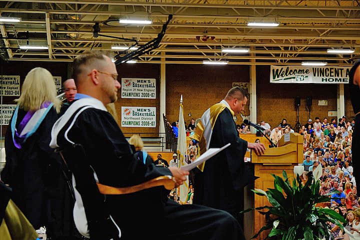 [CREDIT: Lauren Kasz] Assistant Principal Bruce Fairbanks addresses graduates at the Pilgrim High School Class of 2017 graduation.