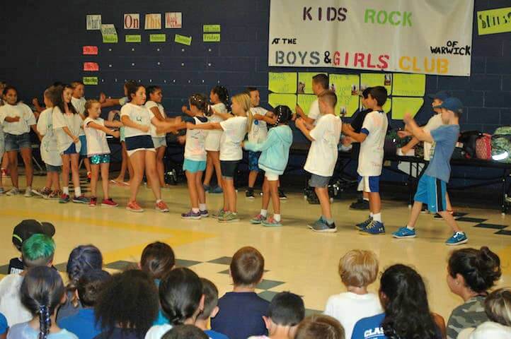 [CREDIT: Rob Borkowski] Boys & Girls Club Group 4, comprised of kids headed to the fourth grade, perform at the Oakland Beach location Friday.