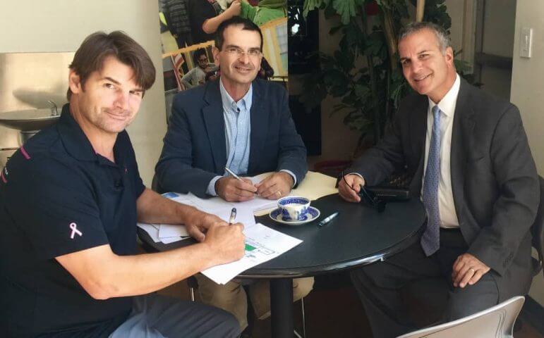 [CREDIT: Gamm Theatre] L to R: Gamm Managing Director Oliver Dow, Stephen Soscia of Mutual Property Associates, Gamm Board President Leon C. Boghossian III sign the lease for Gamm Theatre to move to 1245 Jefferson Blvd., in the building once occupied by Ocean State Theatre.