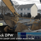 [CREDIT: Rob Borkowski] An excavator works on a trench along Sandy Lane Monday.