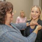 [CREDIT: CCRI] Irina V. Diffley of Warwick recently was inducted into the Gamma Lambda Chapter of Alpha Delta Nu nursing honor society at CCRI. Pictured above, Professor Linda A. Ethier pins Diffley at the ceremony.