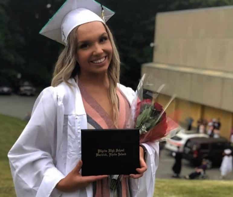 [CREDIT: Kim Wineman] Corinna Dreyer pauses for a post graduation snapshot at CCRI following Pilgrim High School's 2019 graduation.