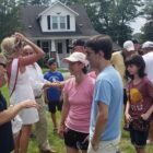 [CREDIT: Rob Borkowski] From left, Astronaut Woody Spring speaks with Lynn Antonelli and her nephew, Christian Tanguay, 17, after the Conimicut Apollo 11 anniversary parade.