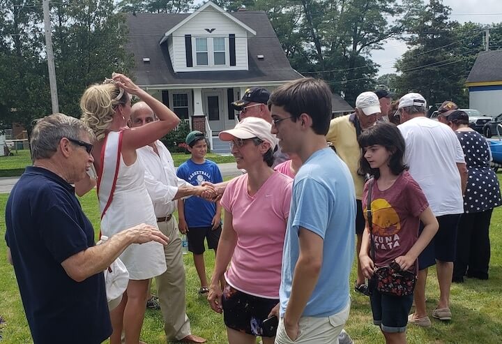 [CREDIT: Rob Borkowski] From left, Astronaut Woody Spring speaks with Lynn Antonelli and her nephew, Christian Tanguay, 17, after the Conimicut Apollo 11 anniversary parade.