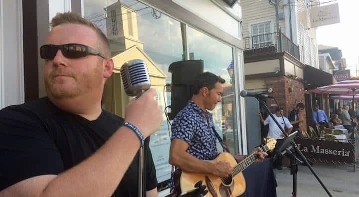 [CREDIT: Rob Borkowski} Guitarist Jim Joly, also proprietor of Greenwich Bay Wealth Management, perform for the crowd during Thursday's Music on Main Stroll in East Greenwich.