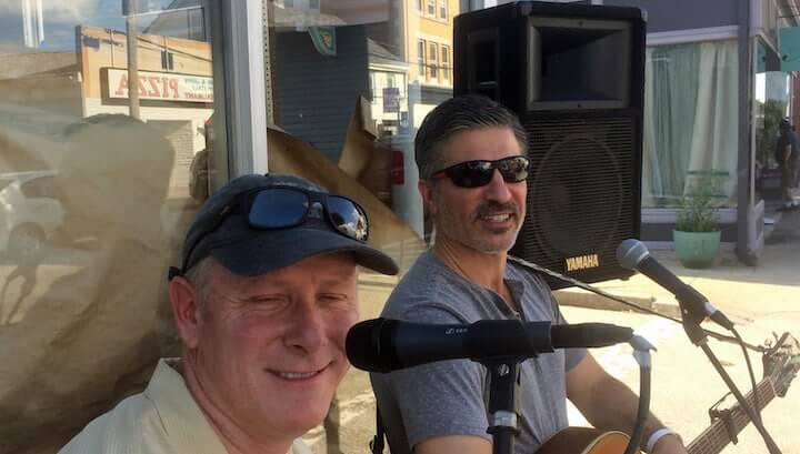 [CREDIT: Rob Borkowski} Ernie Frizzle and George Eskalis perform outside The Revival restaurant during Thursday's Music on Main Stroll in East Greenwich. "We bascially said, 'Hey, let's go do it,' Ernie said of their plan for the night.