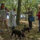 [CREDIT: Mary Carlos] Deacon John Baker of St Catherine’s in Warwick blesses dogs and cats at Warwick City Park Saturday, Sept. 17. At center, Julie Sussman and Tessa, dressed as a hot dog, receive their blessing.[CREDIT: Mary Carlos] Deacon John Baker of St Catherine’s in Warwick blesses dogs and cats at Warwick City Park Saturday, Sept. 17. At center, Julie Sussman and Tessa, dressed as a hot dog, receive their blessing.