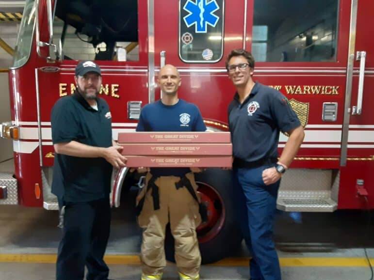 [CREDIT: D'Angelo Sandwiches] Firefighters at West Warwick's Fire Department, with D’Angelo employee Jason Mucci, on Sunday. D'Angelo delivered free sandwiches to the station Sept. 29.