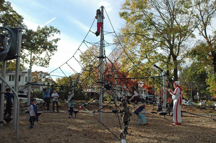 [CREDIT: Rob Borkowski] Children climb higher than was previously possible atop new playground equipment at the Salter Grove Park ribbon cutting Oct. 26.