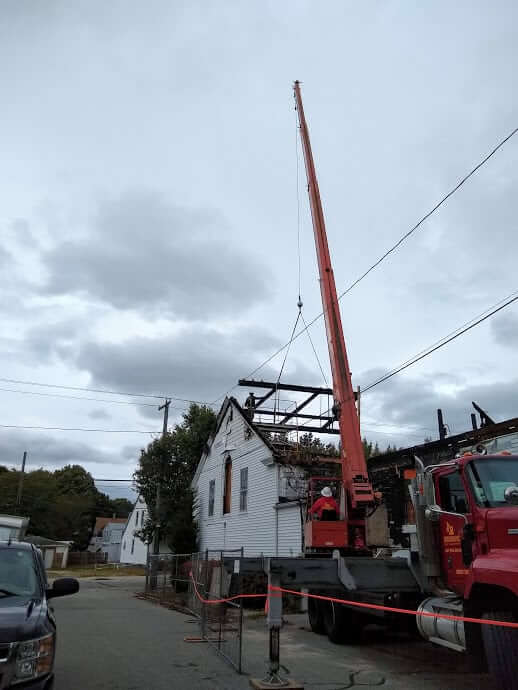 [CREDIT: Lincoln Smith] Lomad Heavy Construction continued demolition of Woodbury Union Church Thursday. Rebuilding the church is expected to be finished in the spring.