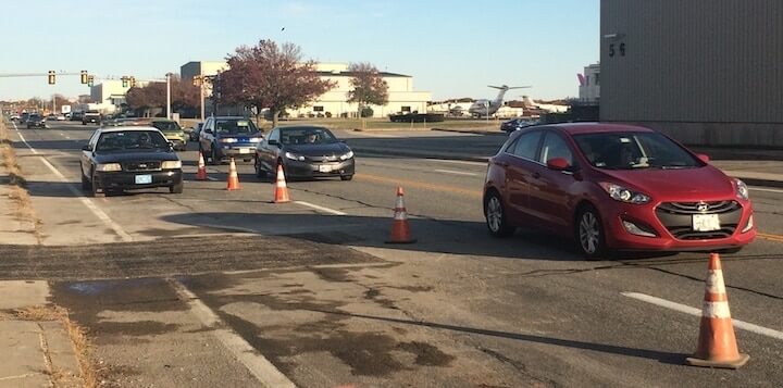 [CREDIT: Rob Borkowski] One lane of Airport Road near the Post Road intersection was closed Monday as the Warwick Water Department repaired a water main.