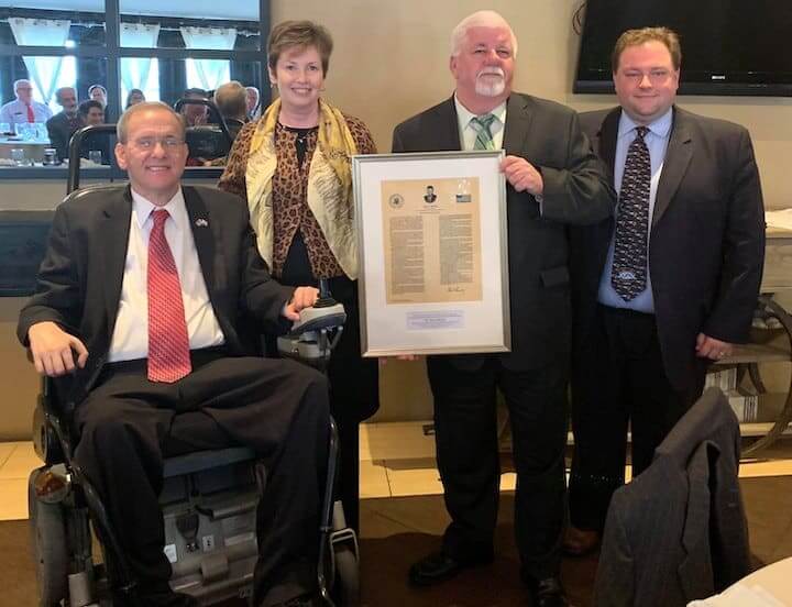 [CREDIT: Congressman Langevin's office] Nancy Beattie is presented with the Congressman John Joseph Moakley Award for Exemplary Public Service by Congressman Jim Langevin and representatives from the Greater Boston Federal Executive Board.