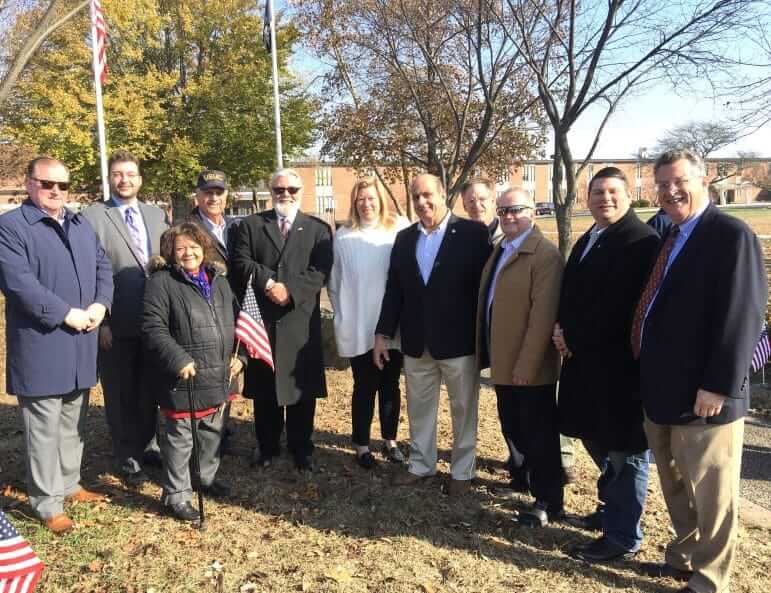 [CREDIT: Kim Wineman] Several Warwick officials attended Warwick's Veterans Day ceremony at Warwick Veterans Memorial Jr. High Nov. 11, 2019. From left, Sen. Michael J. McCaffrey, Councilors Jeremy Rix, Ed Ladouceur and Donna Travis, Reps. Dave Bennett, (D-Dist. 20), Sen. Erin Lynch Prata (D-Dist. 31, Warwick, Cranston), Mayor Joseph J. Solomon, Councilors Richad Corley, Jim Mcelroy and Steve McAllister, and Sen. Mark McKenney, (D-Dist. 30.