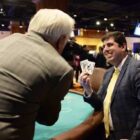 [CREDIT: LPPIB] Rep. Joseph J. Solomon Jr. holds up a winning hand at Twin River Casino in Lincoln on Thursday during the seventh annual Holiday Blackjack Tournament for Charity. Representative Solomon won $7,500 for Volunteers of Warwick Schools.