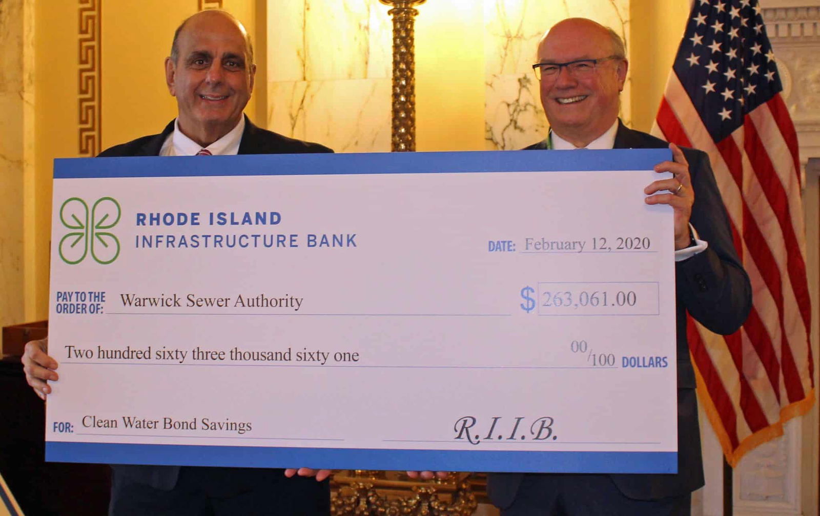 [CREDIT: RI Infrastructure Bank] Warwick Mayor Joseph J. Solomon accepted a check for $263,000 in savings from the Jeffrey R. Diehl, Executive Director and CEO of Rhode Island Infrastructure Bank, for the Warwick Sewer Authority Wednesday.