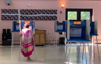 [CREDIT: Rob Borkowski] A woman casts her ballot at Pilgrim Senior Center Tuesday, Sept. 8, 2020. By noon Monday, 187,000 people had cast their ballots, contributing to Warwick 2024 Election Results.