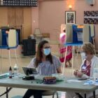 [CREDIT: Rob Borkowski] From left, poll workers Julie Thurston and Marge Ovalles wait for the next round of voters to pass through Pilgrim Senior Center during the 2020 statewide primary Sept. 8.