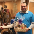 [CREDIT: Tiger Eye Gift Shop] Ron Amore, owner of Tiger Eye Gift Shop, in his shop.