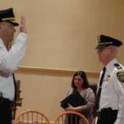 [CREDIT: Rob Borkowski] Maj. Brad Connor, recently promoted, was honored for achieving the rank in April 2017. At right, former WPD Chief Col. Stephen McCartney stands with former Mayor Scott Avedisian to formalize the promotion. Connor has been named the next WPD Chief by incoming Mayor Frank Picozzi.