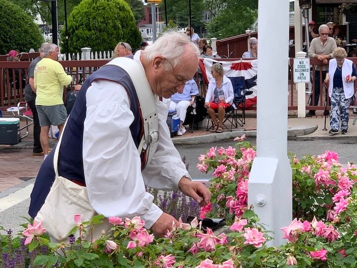 [CREDIT: Rob Borkowski] A reenactor adjusts his glasses as he prepares his attire for the 2021 Gaspee Day Parade.