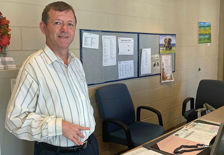 [CREDIT: Rob Borkowski] Stephen Englert, at the front desk at Pilgrim Senior Center. 