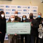 [CREDIT: Sen. Jack Reed's Office] US Sen. Jack Reed (D-RI) and Larry Warner Chief Community Impact and Equity Officer at United Way RI, show off a check for nearly $2 million to aid the hungry and homeless in RI>