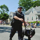 [CREDIT: Rob Borkowski] Ptlm. Paul Wells and his partner, K9 Fox, at the start of the 2017 Gaspee Day Parade.