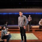 CREDIT: Trinity Rep] Jack Dwyer, center, and the ensemble cast of Trinity Rep's "The Inheritance."