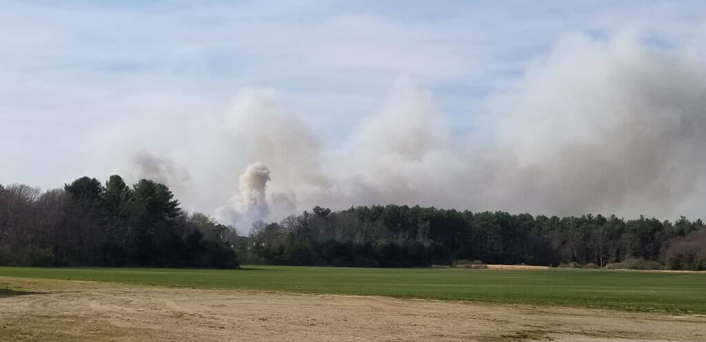 [CREDIT: RI Breaking News Service] The RI National Guard and several fire crews are fighting an Exeter brush fire expected to cover 700 acres Friday.