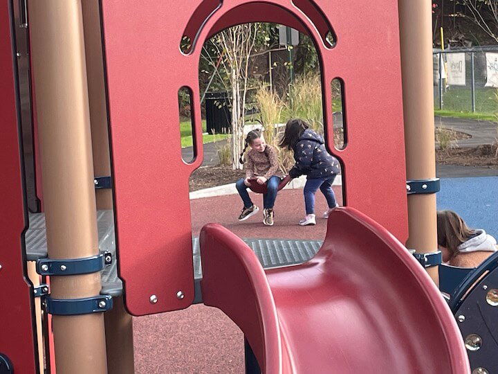 [CREDIT: Rob Borkowski] New friends at play at the new Apponaug Playground Tuesday during the ribbon cutting ceremony.