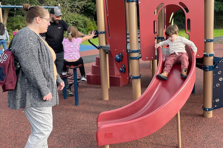 [CREDIT: Rob Borkowski] At left, Melinda Crispy and her son, Roman enjoy the new Apponaug Playground.