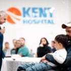 [CREDIT: CNE] U.S. Sen. Jack Reed speaks during a ceremony honoring Kent Hospital ER doctor and U.S. Army Reserve Medical Corps Major  Dr. Benjamin Misemer Oct. 12, 2023. Sitting with Misemer is his son, Owen.