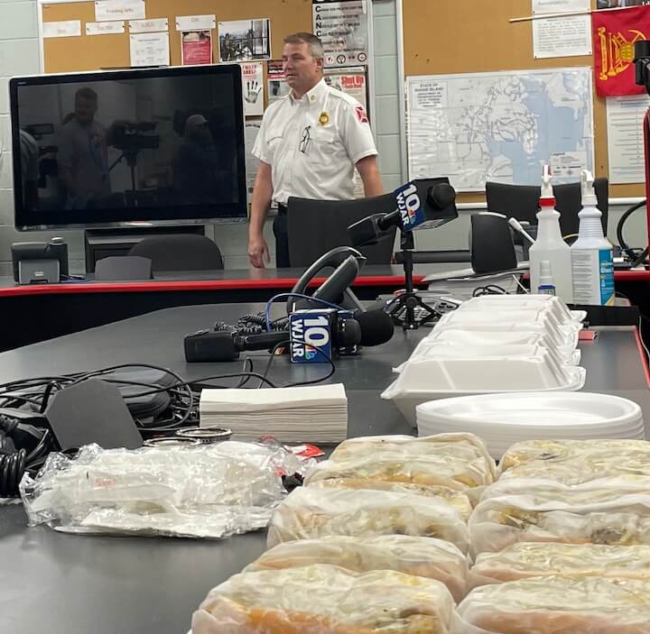 [CREDIT: Rob Borkowski] WFD Dep. Chief Mike Mernick enjoyed a tray of hot wieners during an event honoring his life-saving actions saving two children and a mother from a Providence fire Oct. 15, 2023.